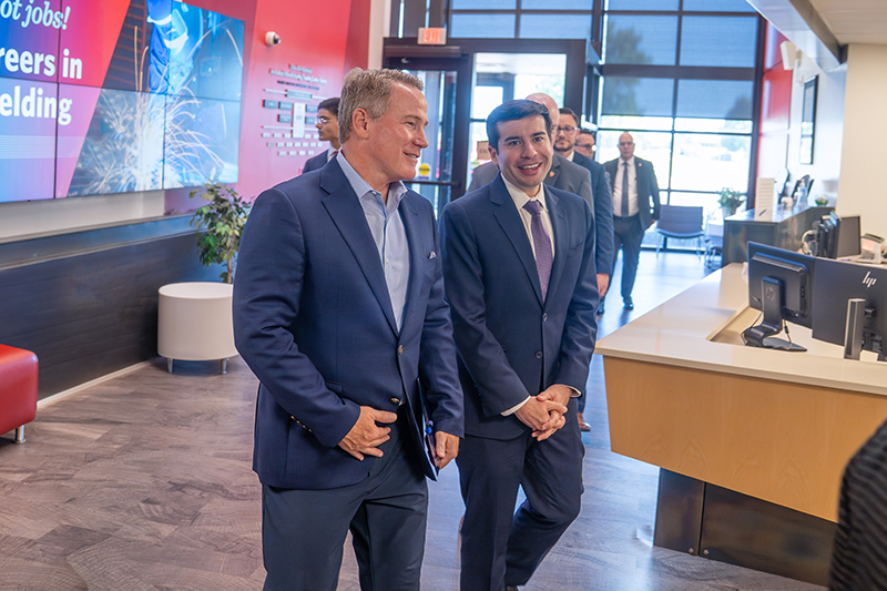 U.S. Senator Jon Husted (left) and Acting U.S. Secretary of Labor Keith Sonderling walk into the Dana Center for a workforce roundtable