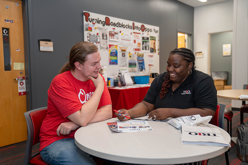 RIO EOC assistant director Alissa Hornbeak works with a student in their office
