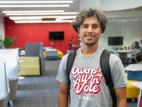 Owens student wearing an Owens is All in to Vote T-shirt