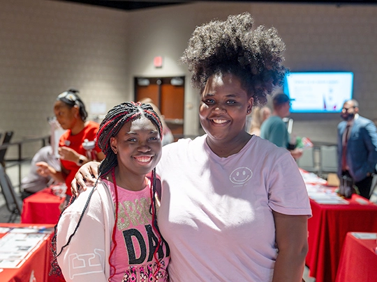 two prospective students at an Owens event