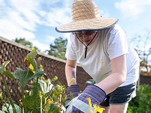 owens student taking care of garden