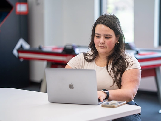 student working on laptop
