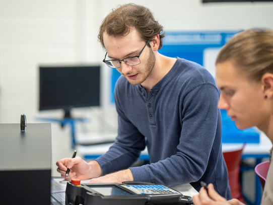 Two students working in mechatronics shop